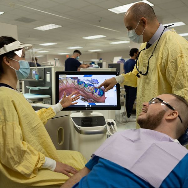 dental students with a patient 
