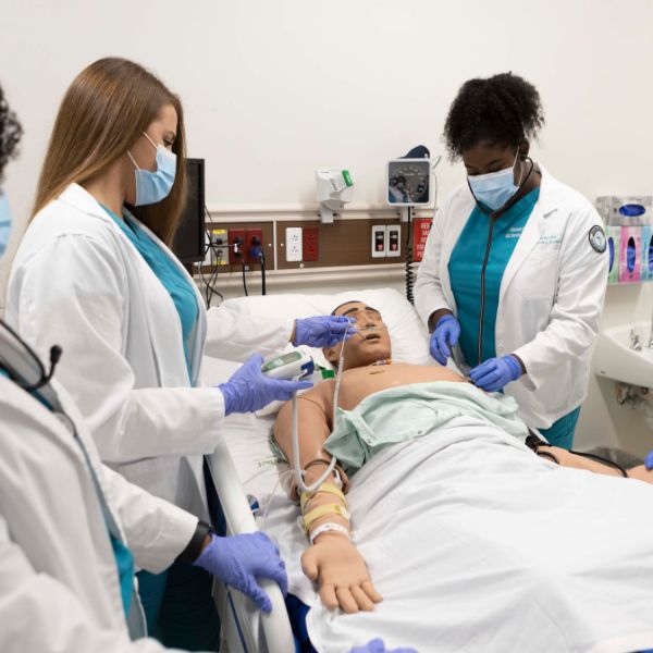 nurses working on a mock patient