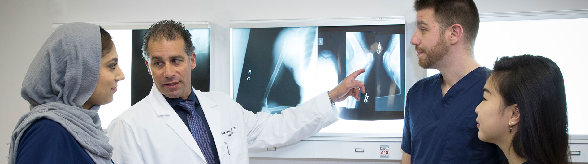 doctor showing x-rays to students