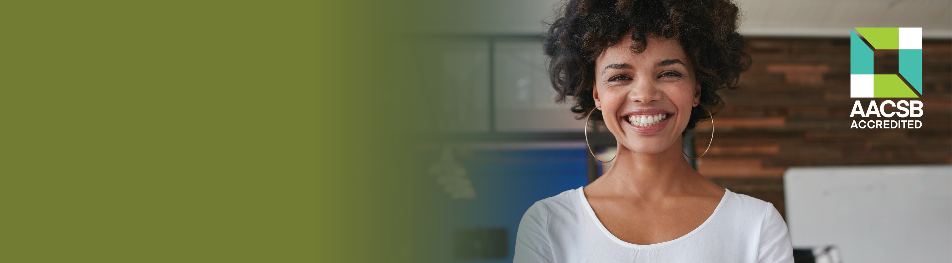 smiling woman with logo of AACSB organization