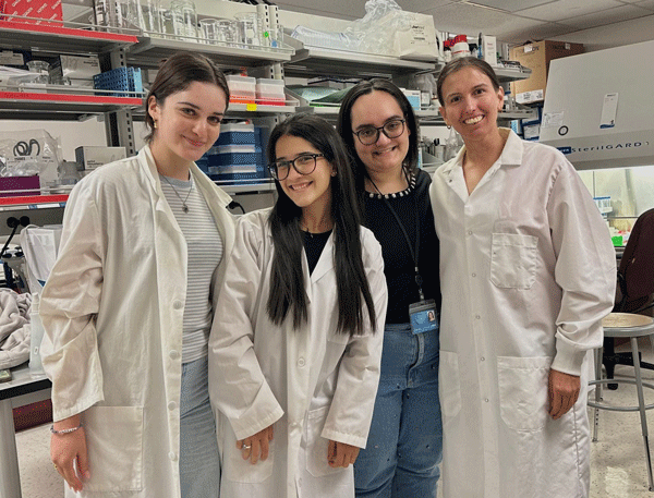 Dr. Robison with 3 research students