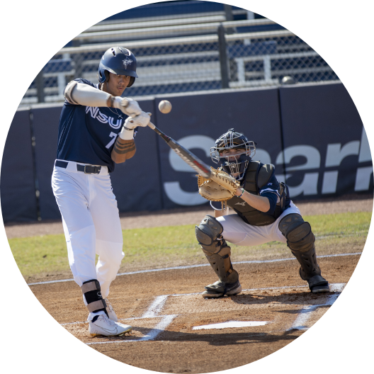 NSU baseball player hitting a ball