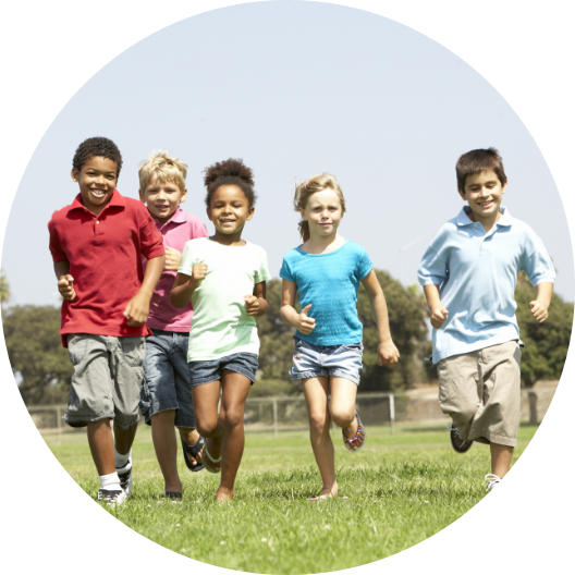 children running towards camera on a field