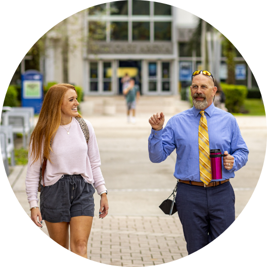 NSU faculty member and student walking on NSU campus