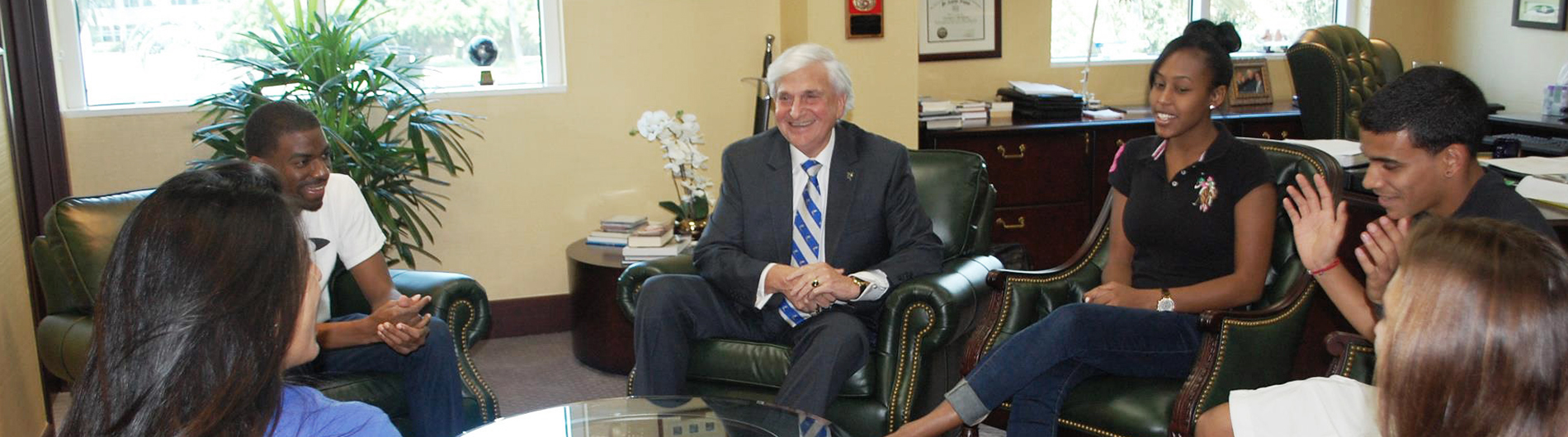 President Hanbury talking with a group of students in his office