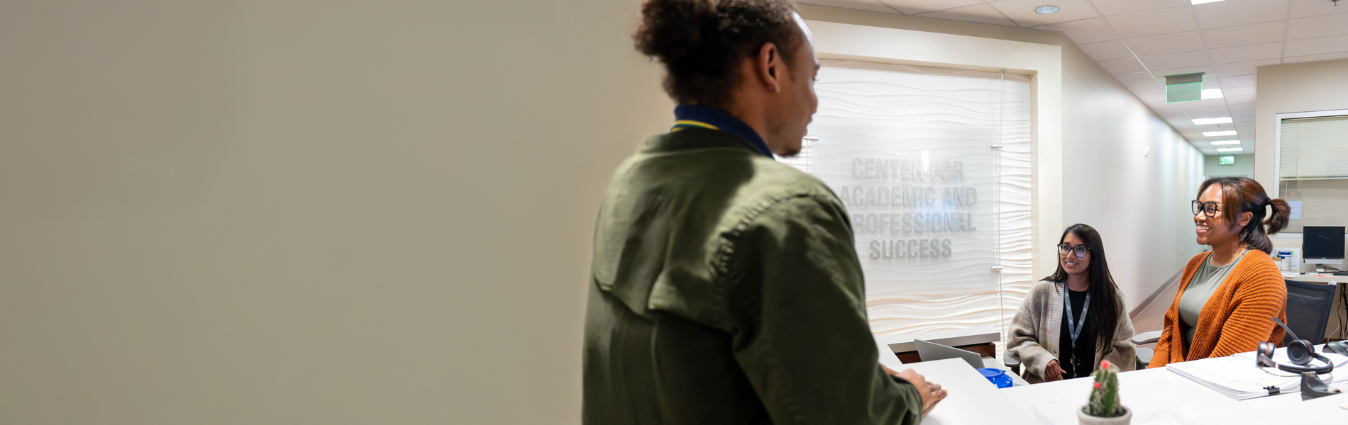 Student receiving assistance in lobby