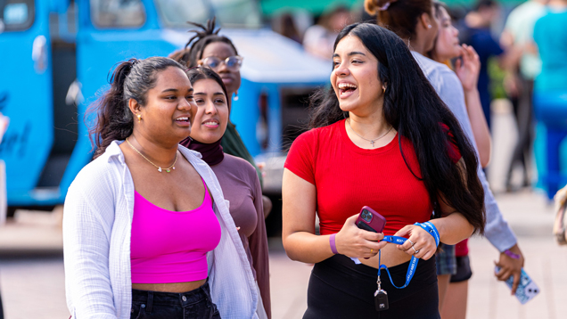 Happy students walking around campus