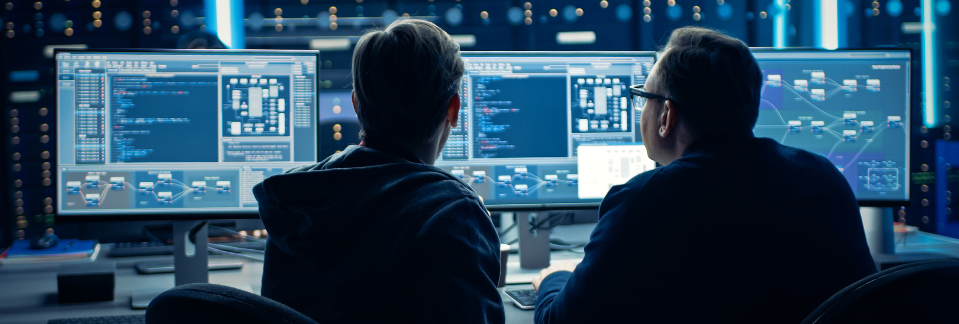 Two programmers working together on a computer