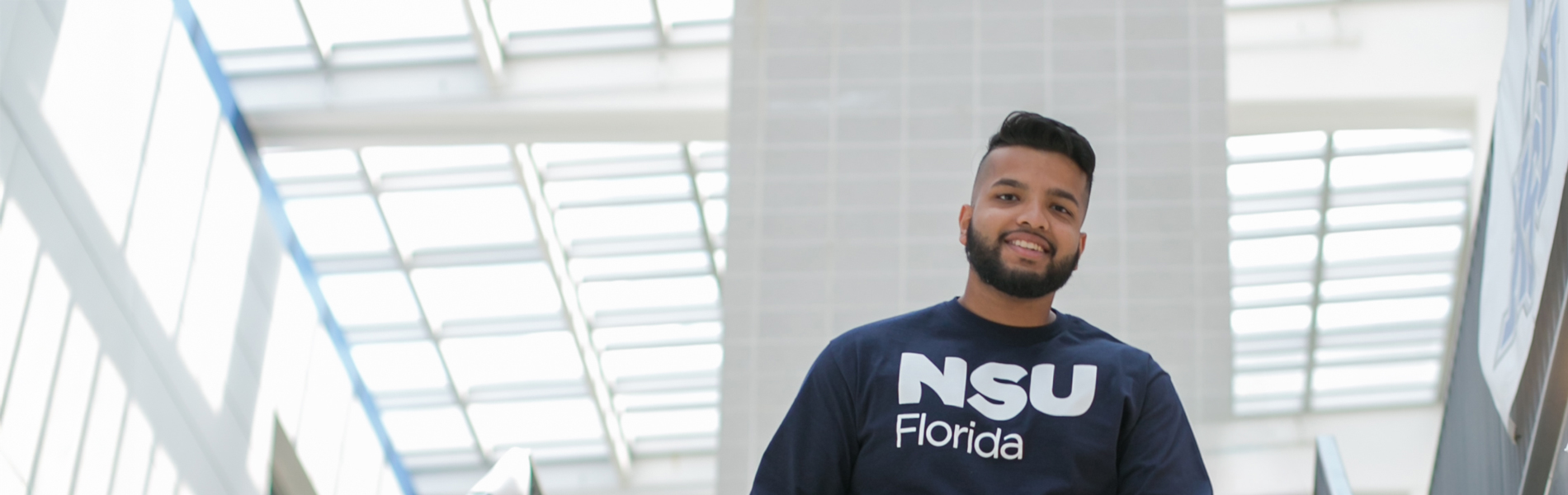 NSU student portrait going down the stairs