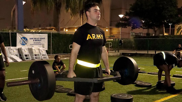 rotc student doing weights on training