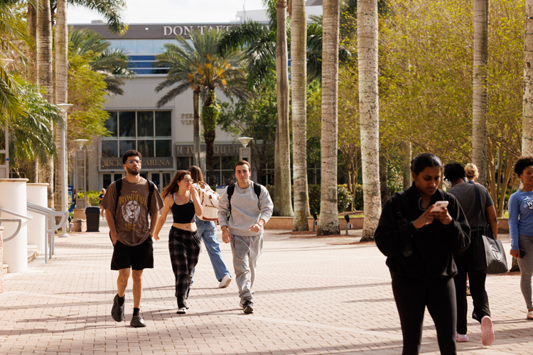 Students walking on campus outdoors