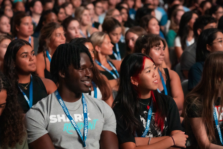 NSU students in the audience listening to orientation
