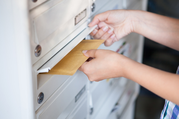 Closeup of a person sending time urgent envelope