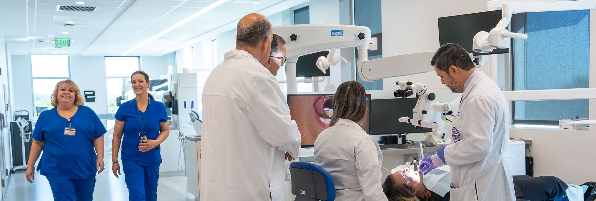 Students and faculty in the dental simulation lab.