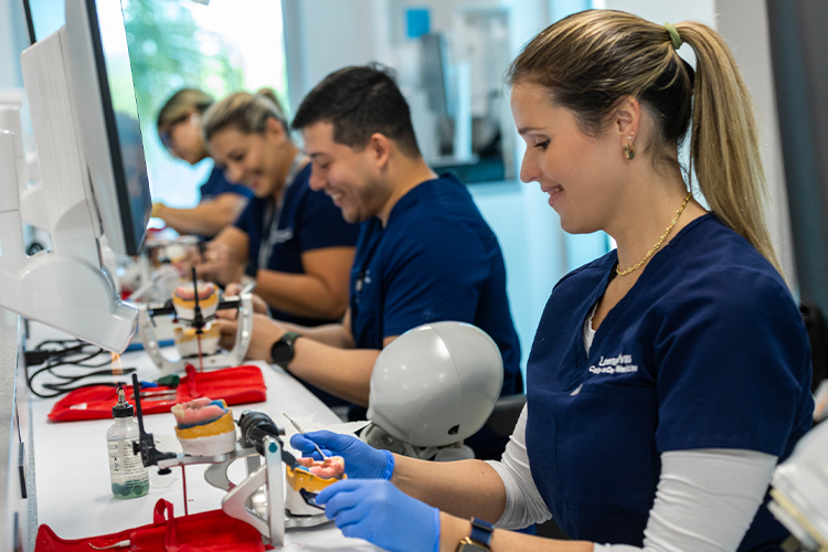 Students practicing in simulation lab.