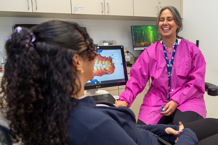 Dentist smiling with her patient