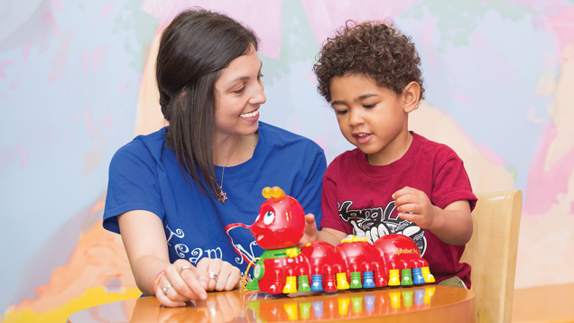 Human services woman professional teaching kid