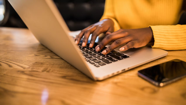 Person using laptop subscribing to nsu works