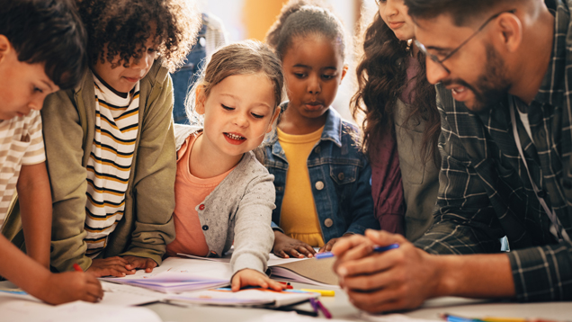 Teacher collaborating with kids and learning community
