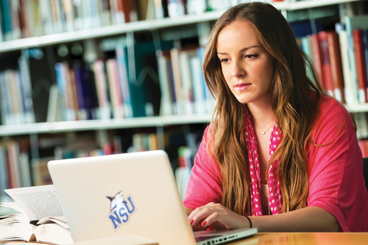 Student studying at library