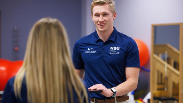 Two students collaborating at computer workstation
