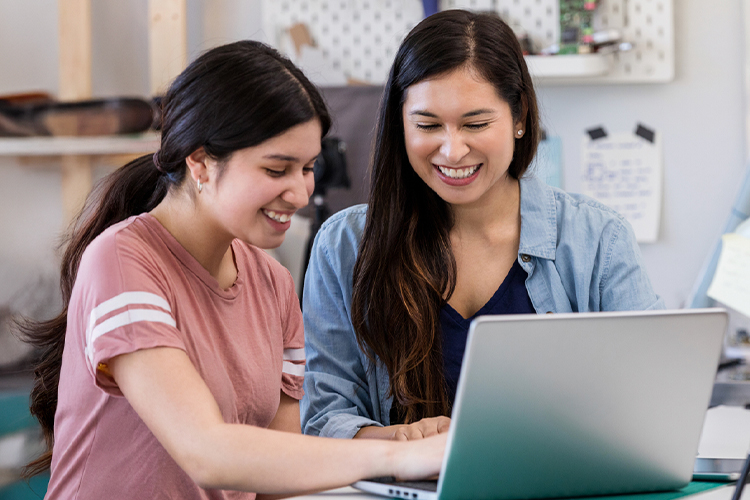 Mother and daughter using a laptop
