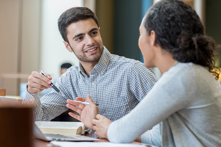 Student speaking to his advisor
