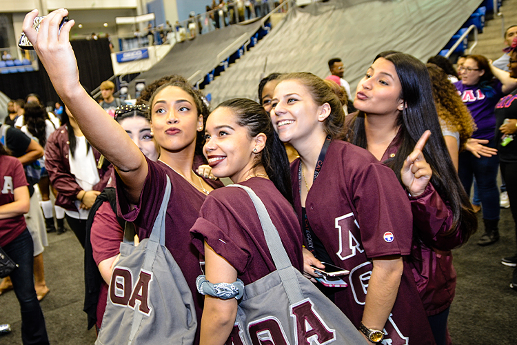 Sorority members posing for a picture at an event