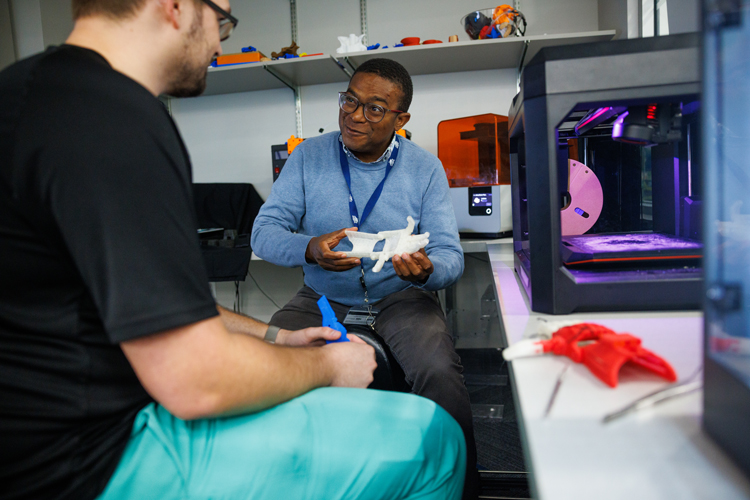 Student and professor at the 3-D imaging lab in the health professions division