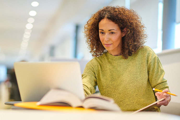 University student in college library