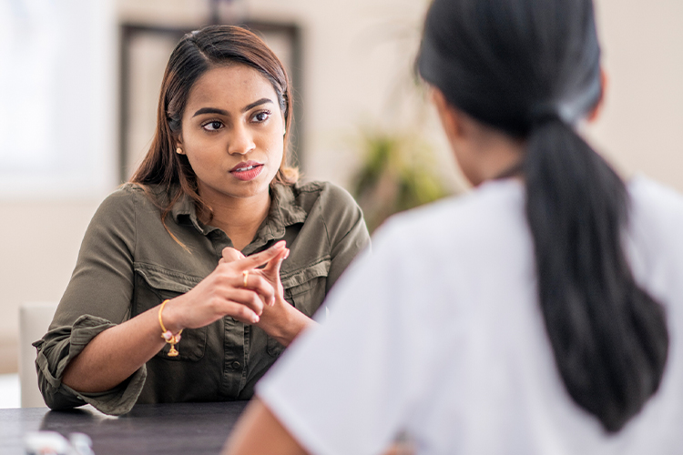 Woman speaking to her counselor