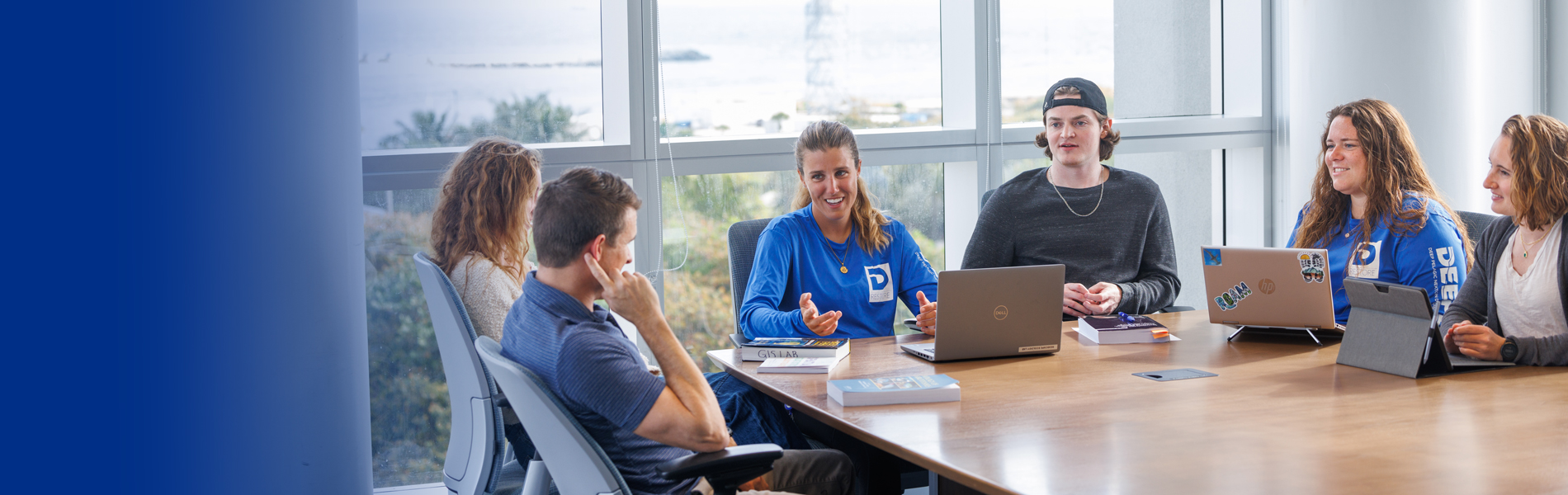 NSU HCAS students sitting on meeting room receiving mentoring