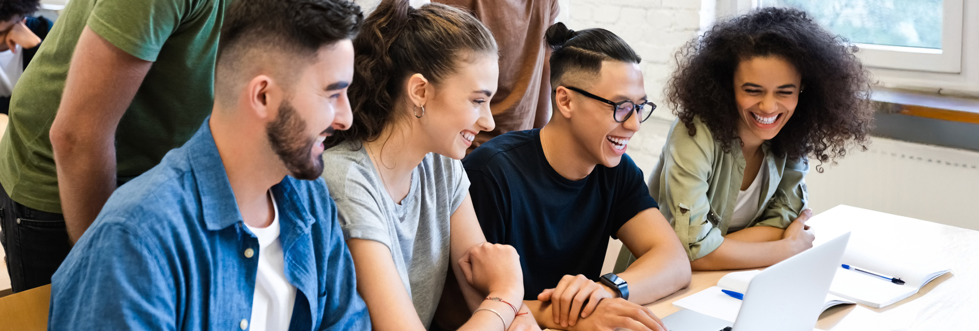 Group of students studying together in class