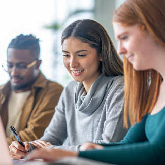 Three students studying in class