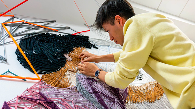 Art student working with yarn
