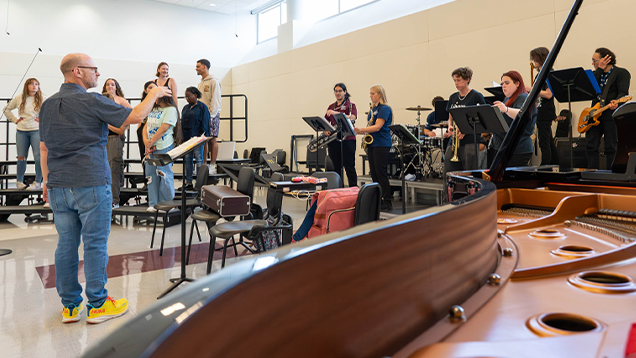 Group of students playing their musical instruments in class