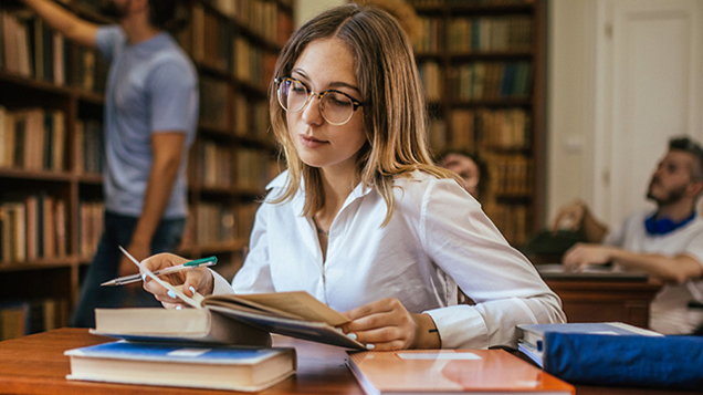 Group of students studying in the library