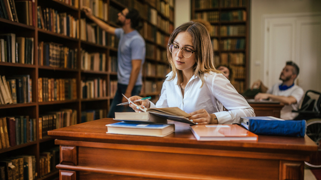 Group of students studying in the library