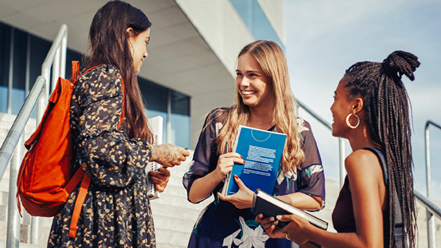 Group of students talking outside.