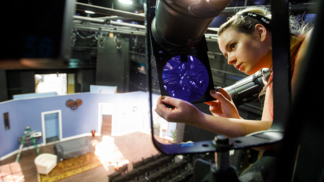 Woman lighting a stage