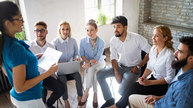 Woman reading to group journal peace