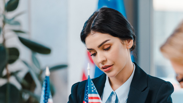 Women from national security affairs international relations looking down reading