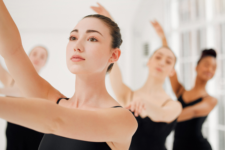 Group of ballet dancers practicing a routine