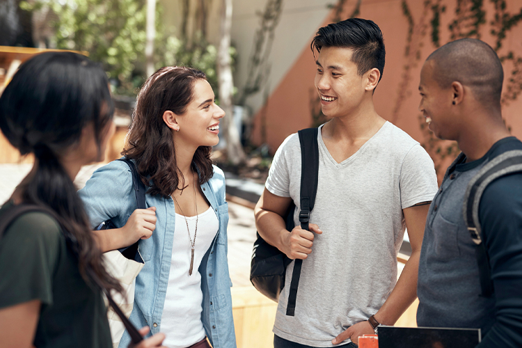 Group of students hanging out together on campus