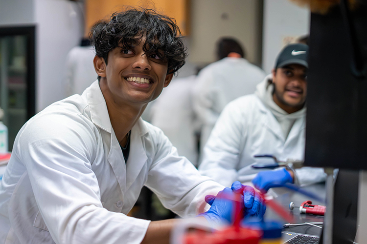 Man smiling in a research lab