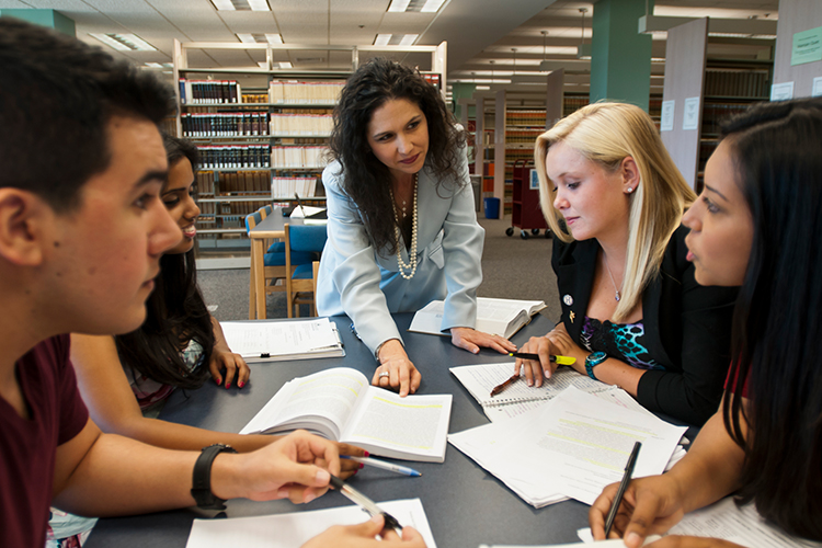 Teacher with her students in the library