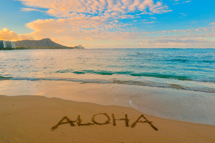 Aloha writing on Hawaii beach sand