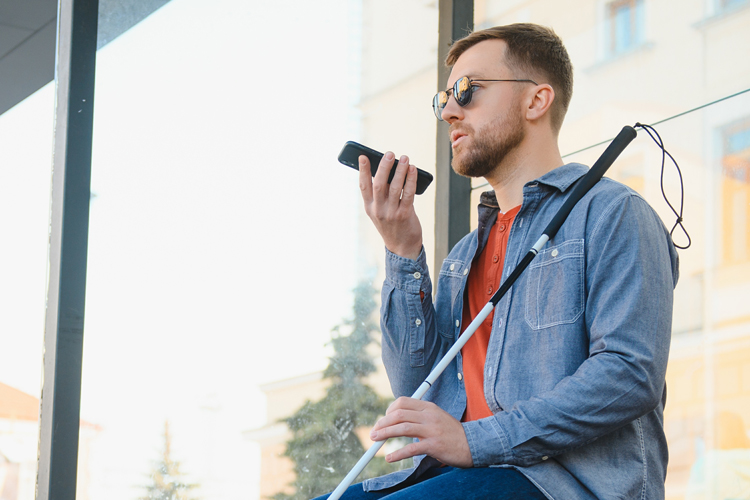 Blind disable student sitting using phone at ADA compliant site