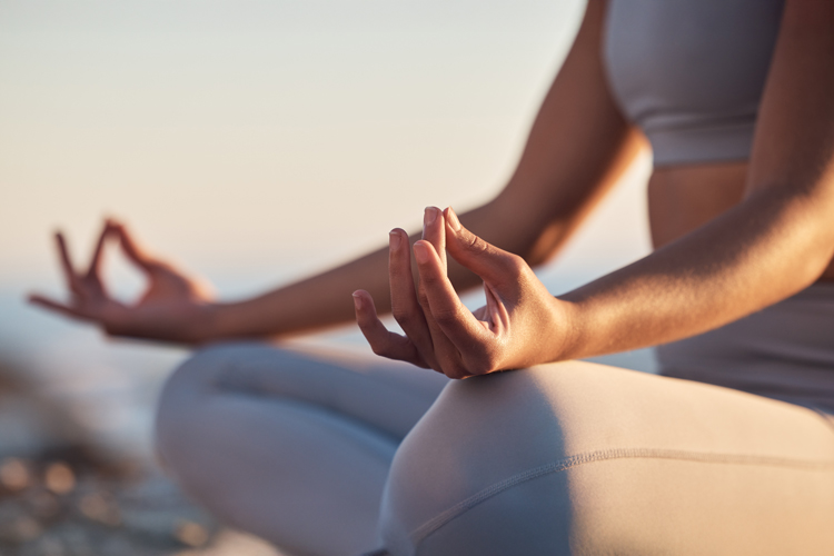 Employee on wellness program doing yoga closeup
