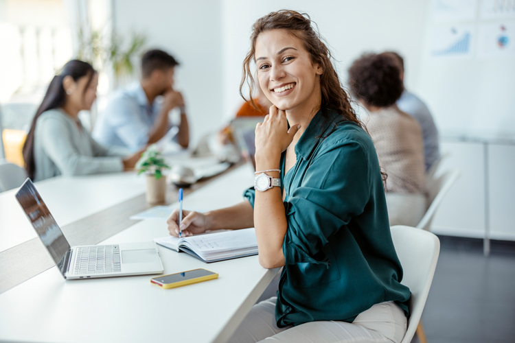 Employee sitting on desk.